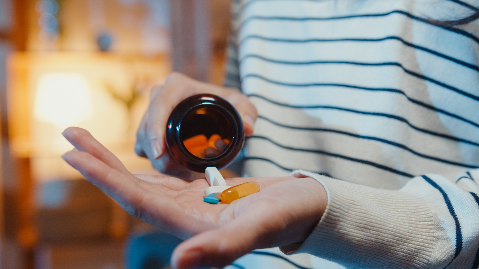 Girl taking medicine after doctor order.