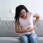 Health care, illness, pain in abdomen, side and back