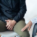 Male patient consults doctor about prostate cancer. Doctor is examining the patient's illness.